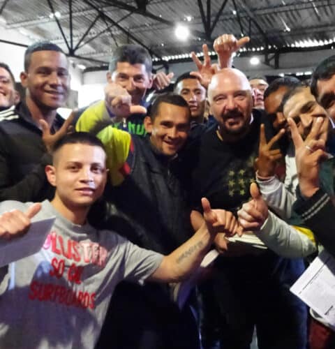 Michael Woroniecki Surrounded by inmates in La Modelo Prison 2024